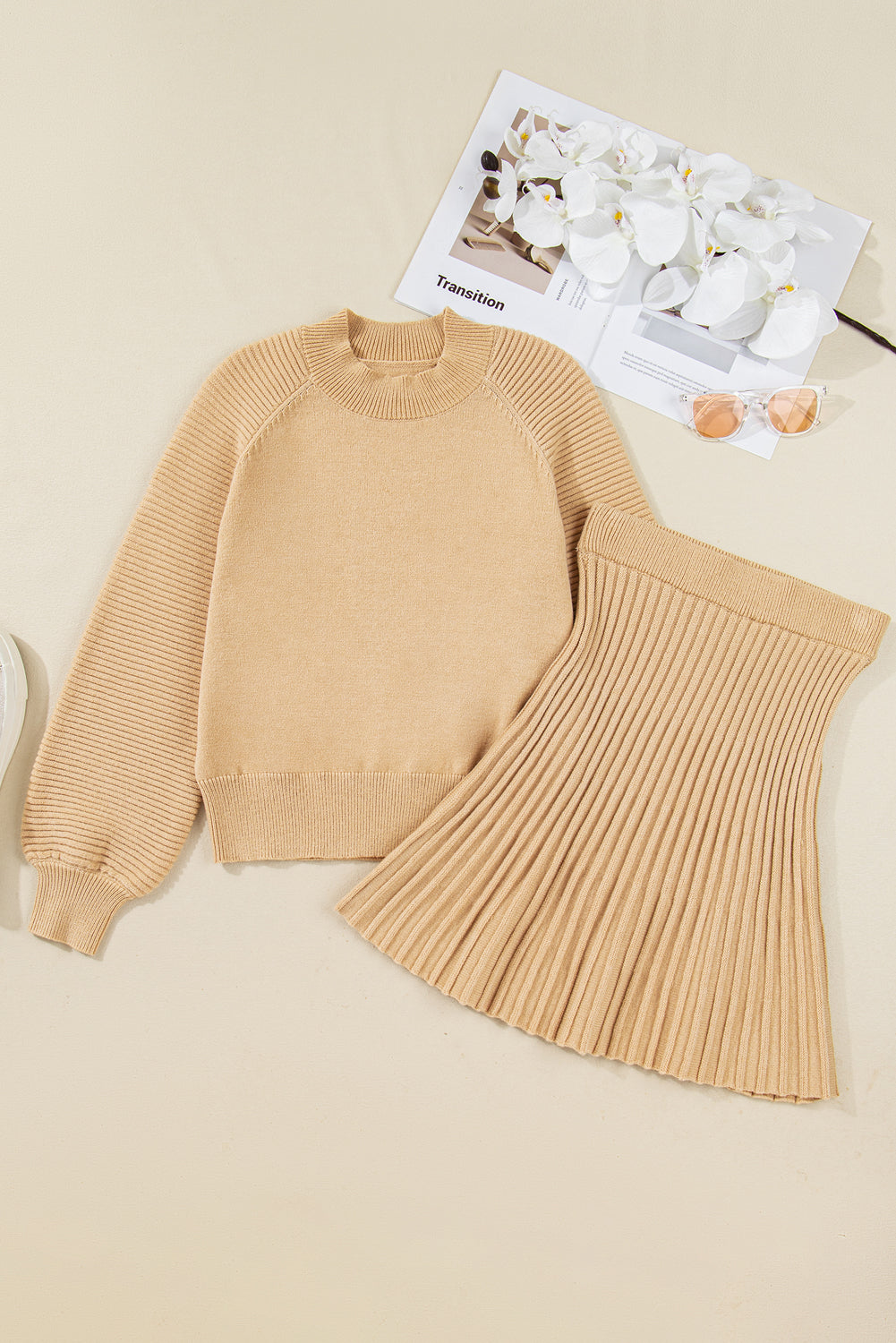 Close up of beige skirt and sweater