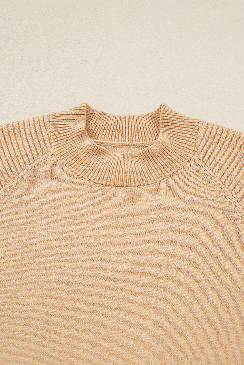 Close up of beige sweater