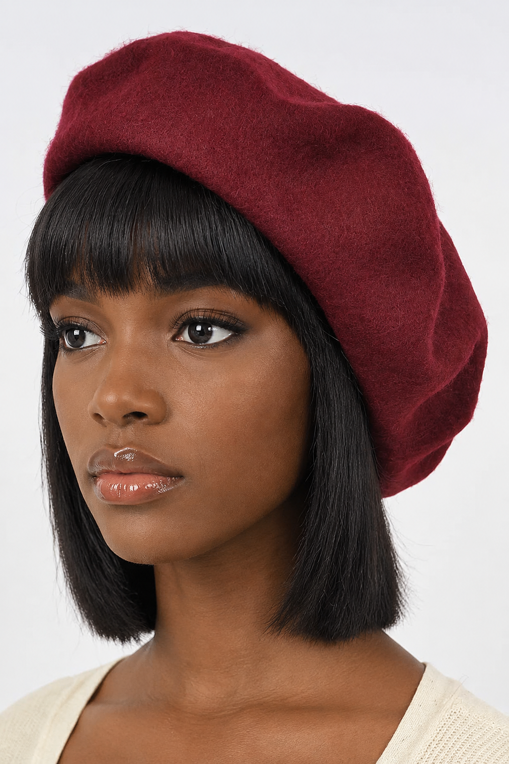 Black woman modeling the black beret