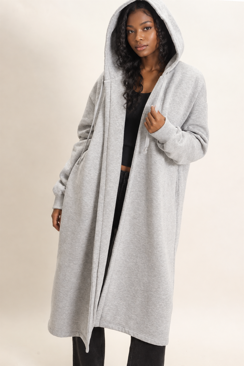 Black woman modeling the gray jacket