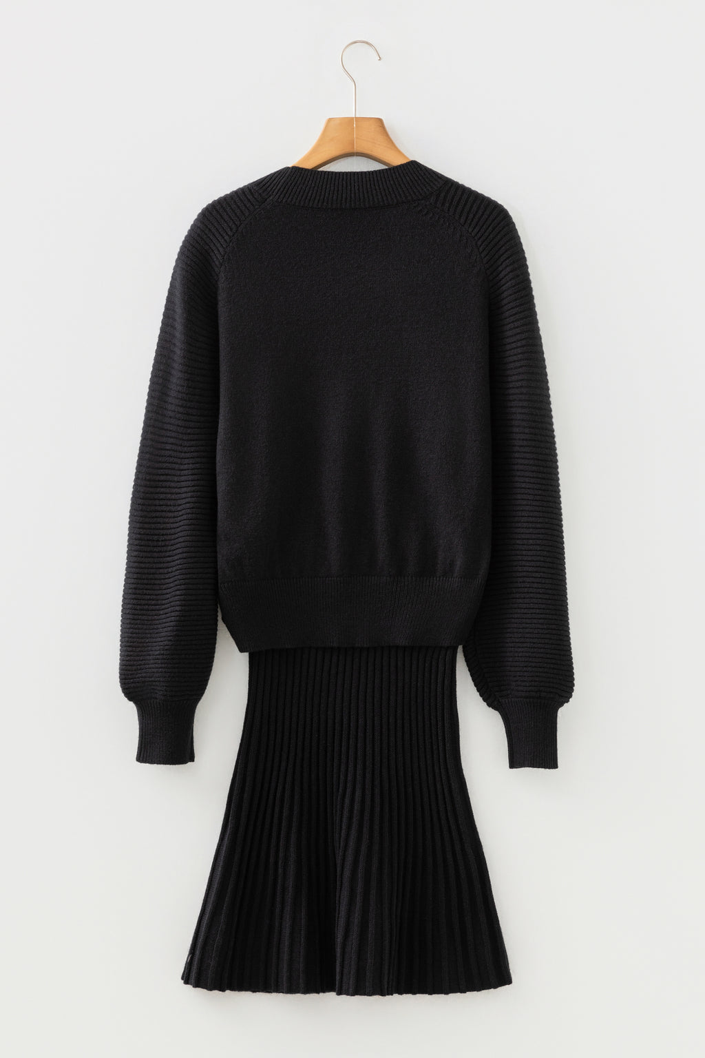 Close up of black skirt and sweater