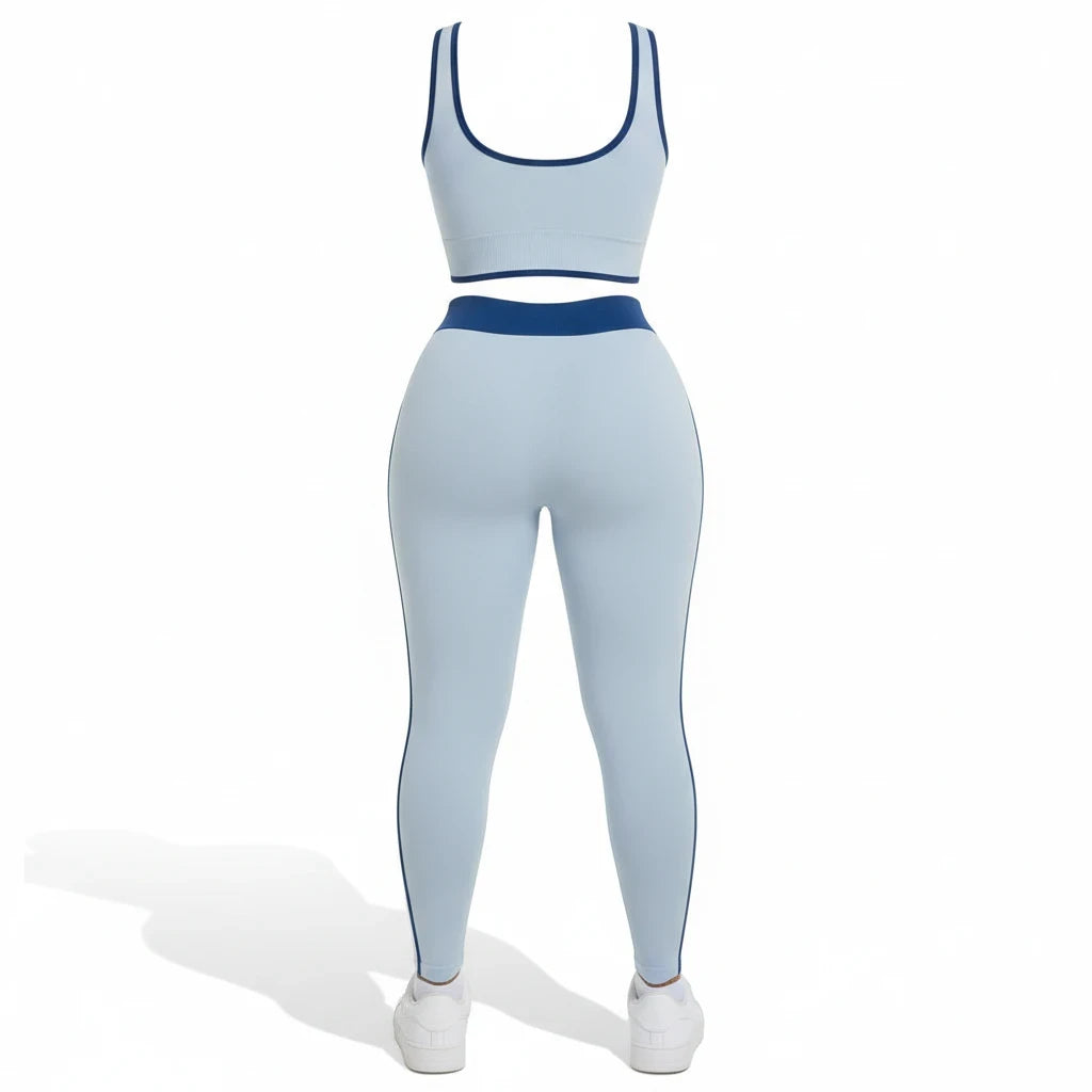 Swerves & Curves Boutique baby blue two-piece workout set with a scoop neck sports bra and high-waisted leggings.