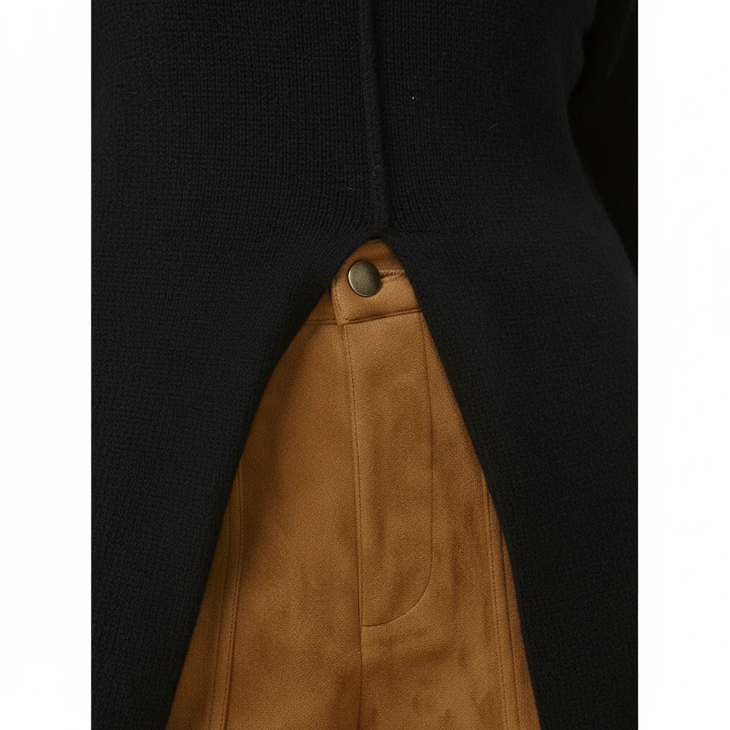 Swerves & Curves Boutique black knit sweater dress featuring a high front slit over tan suede trousers