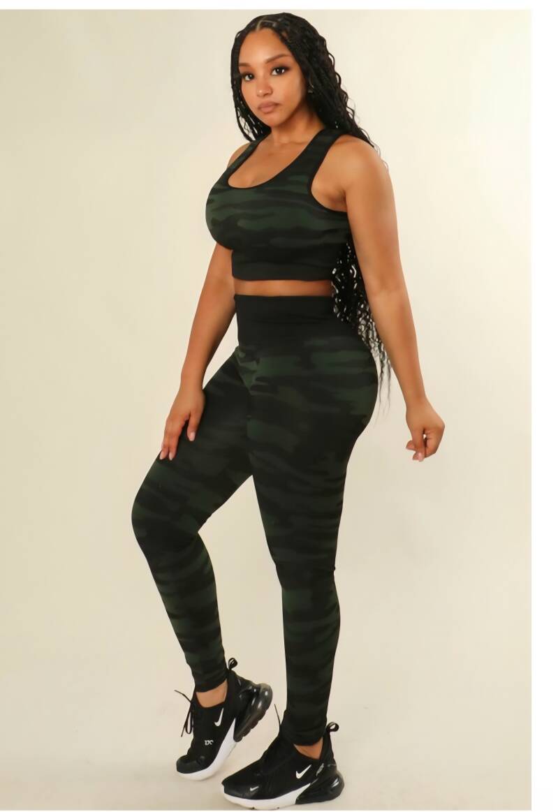 Swerves & Curves Boutique women's green camo two-piece workout set with a sports bra and high-waisted leggings.