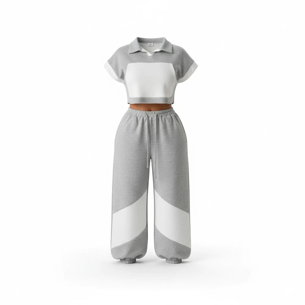 Swerves & Curves Boutique grey and white color-blocked two-piece set with a cropped polo hoodie and wide-leg joggers.
