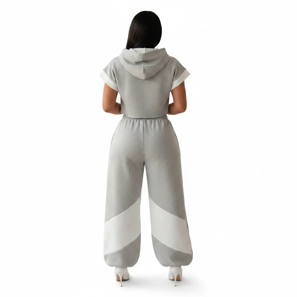 Swerves & Curves Boutique grey and white color-blocked two-piece set with a cropped hoodie and wide-leg joggers