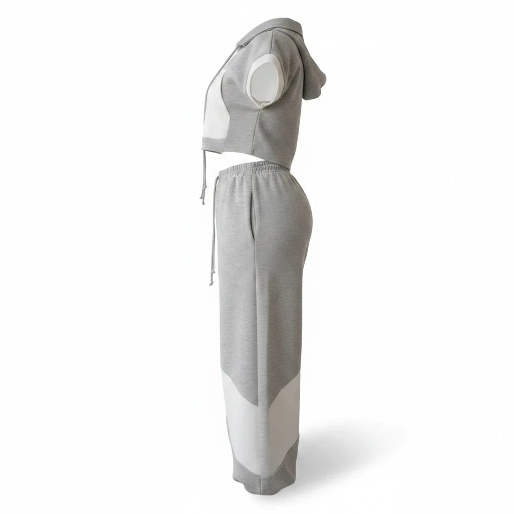 Swerves & Curves Boutique grey and white color-blocked two-piece set with cropped hoodie and wide-leg joggers.