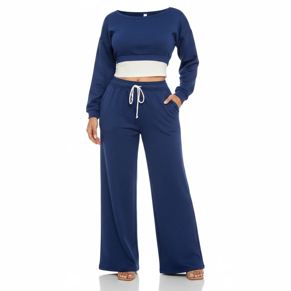 Swerves & Curves Boutique navy blue two-piece lounge set with a cropped sweatshirt and high-waisted wide-leg pants.