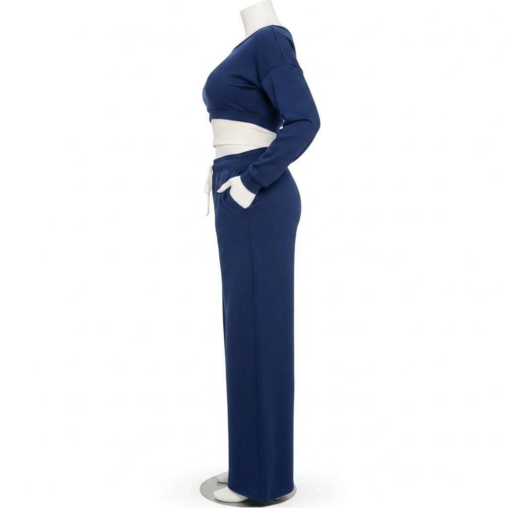 Swerves & Curves Boutique navy blue two-piece lounge set with cropped sweatshirt and wide-leg pants on a mannequin