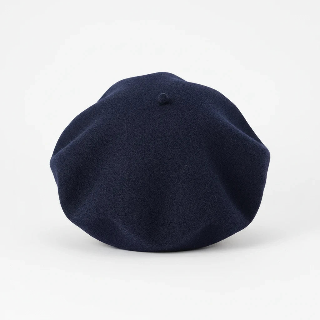 Swerves & Curves Boutique navy blue wool-blend beret with a classic rounded silhouette and soft texture