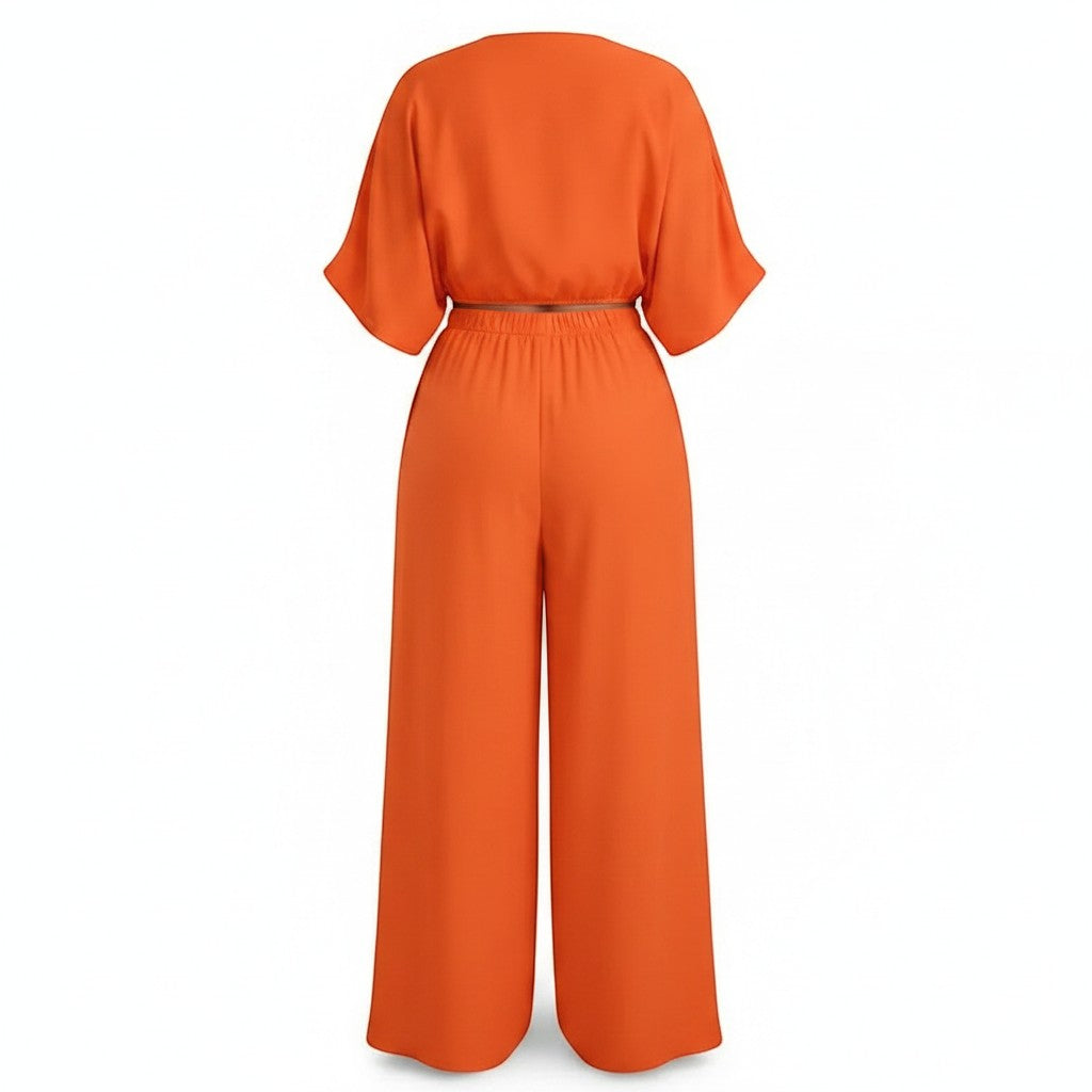 Back view of Swerves & Curves Boutique Willow Breeze Set in peach featuring a cropped top and wide-leg pants.