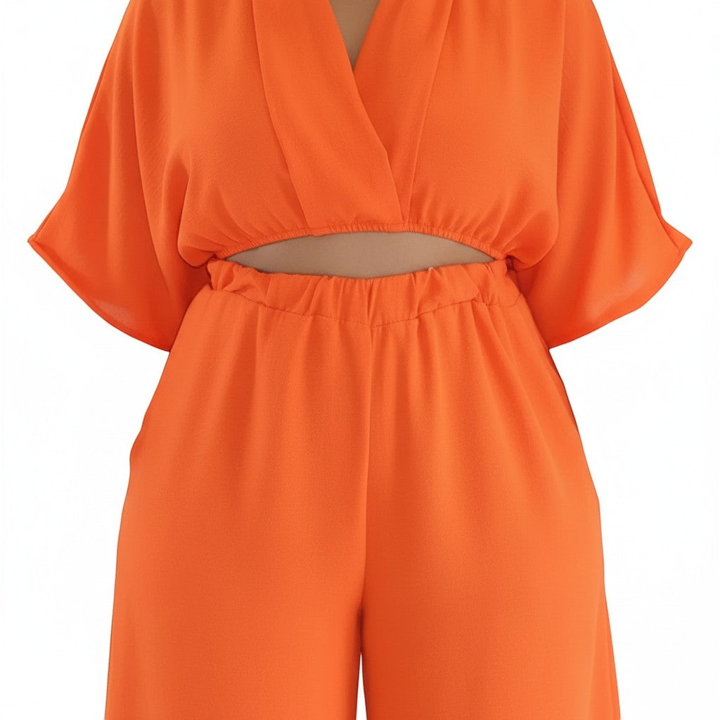 Swerves & Curves Boutique Willow Breeze Set featuring a bright peach cropped wrap top and matching wide-leg pants.
